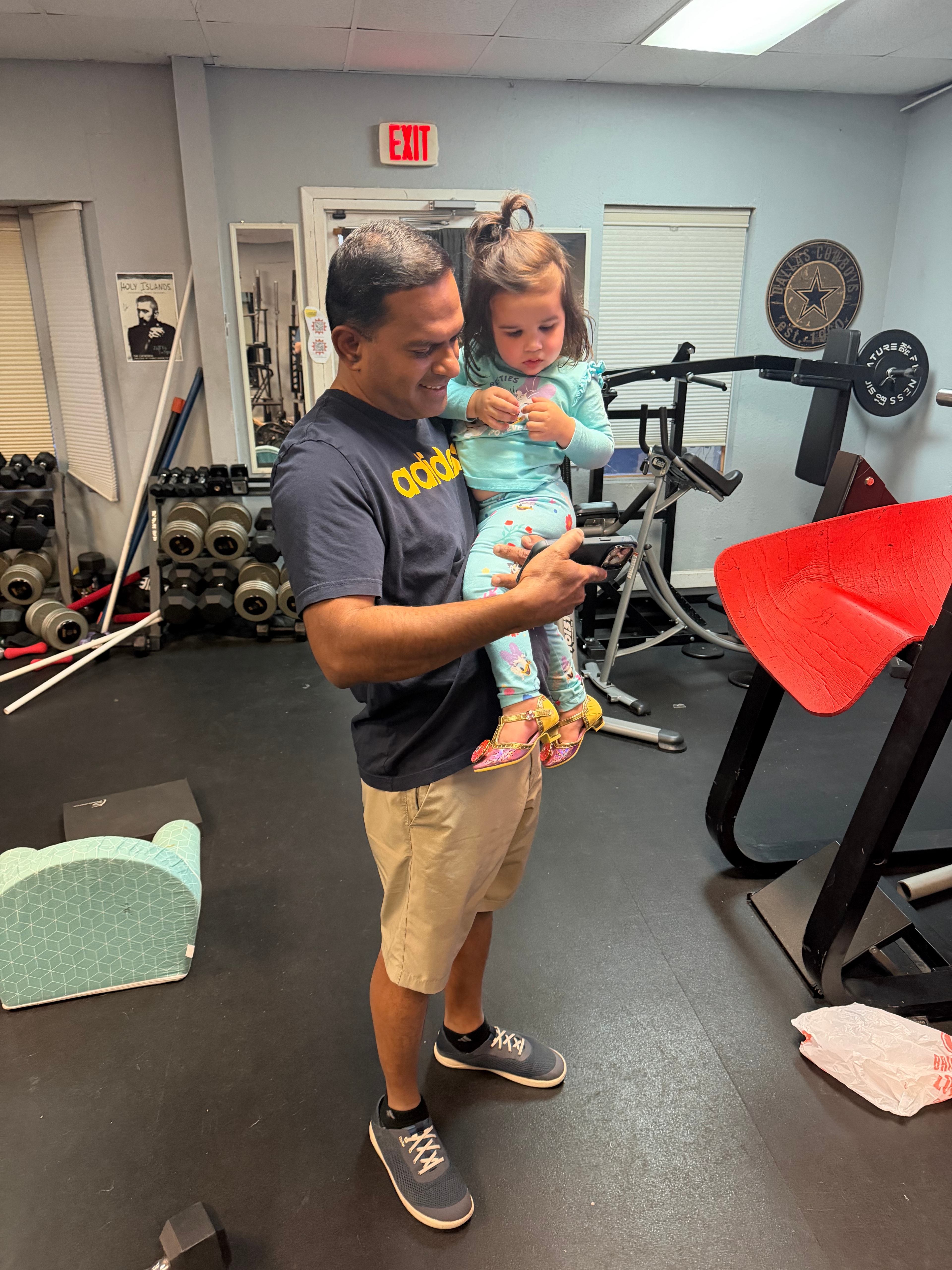 Family-friendly moment inside the PowerHouseATX private gym